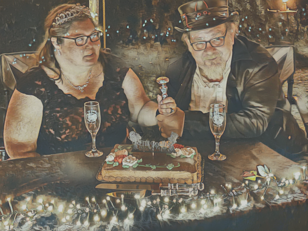 Monster and girl with champagne glasses and a cake - at their wedding.